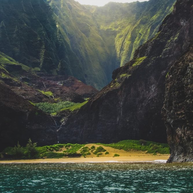 Remote Kalalau Beach with waterfalls.